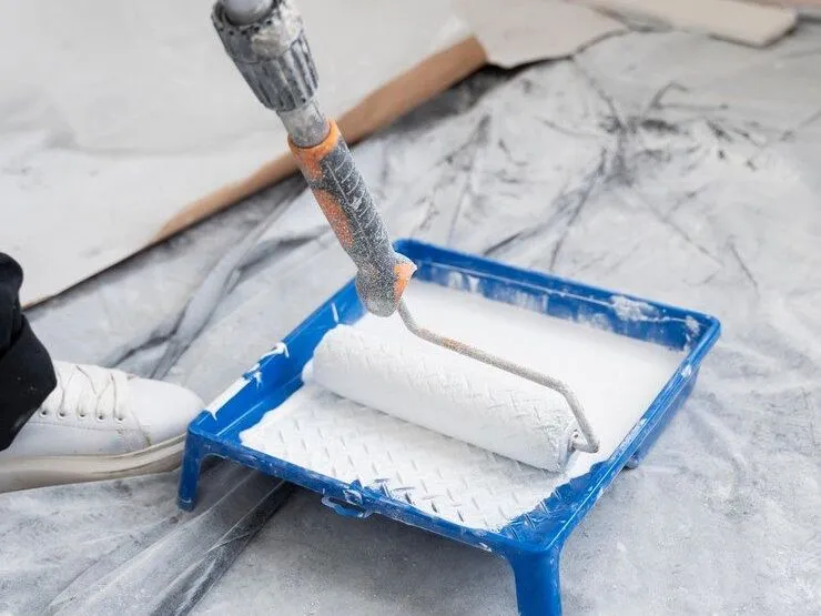 high-angle-contractor-painting-house